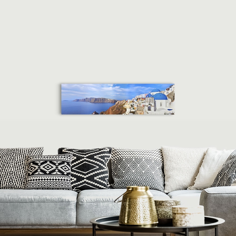 A bohemian room featuring Panoramic view of Oia village on Santorini island, Greece.