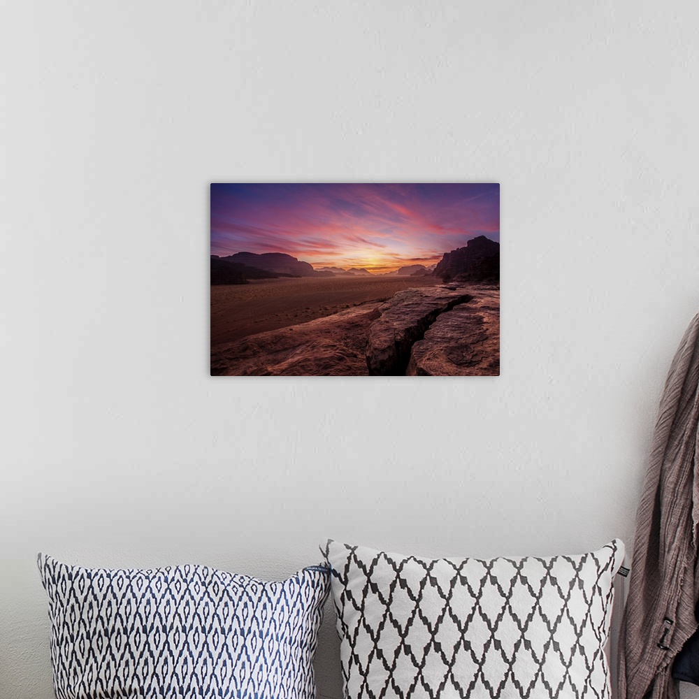 A bohemian room featuring Panorama of a sunset in Wadi rum desert, Jordan.