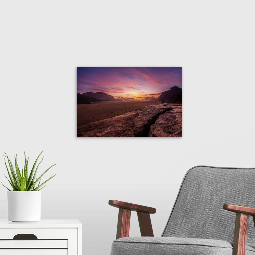 A modern room featuring Panorama of a sunset in Wadi rum desert, Jordan.