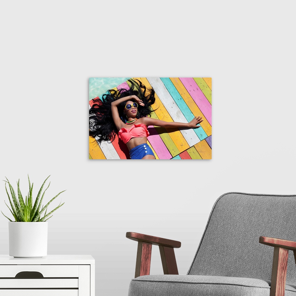 A modern room featuring Tropical summer holiday fashion concept - tanning woman on a wooden pier.