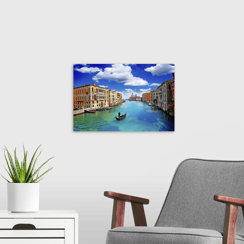A modern room featuring Ancient buildings and gondola along canal grande in Venice Italy.