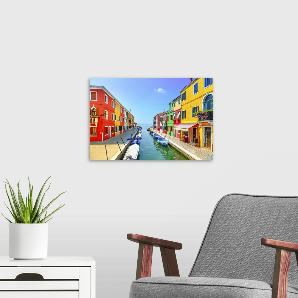 A modern room featuring Venice landmark, Burano island canal, colorful houses and boats, Italy. Long exposure photography.