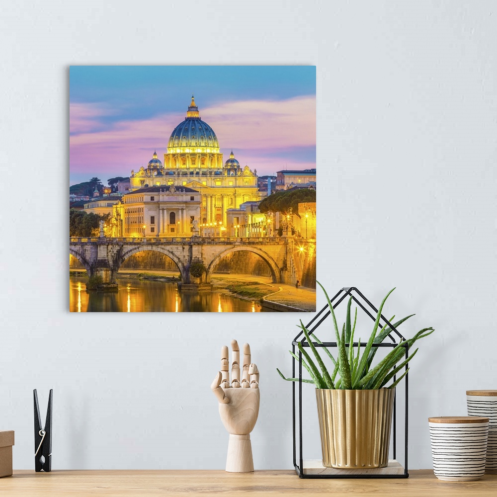 A bohemian room featuring Night view of old roman bridge of Hadrian and St. Peters cathedral in Vatican city Rome, Italy.