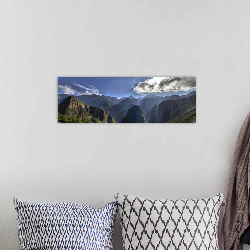 A bohemian room featuring View of Andes Mountain Range from Machu Picchu. Beautiful scenery with sun rays shining through t...
