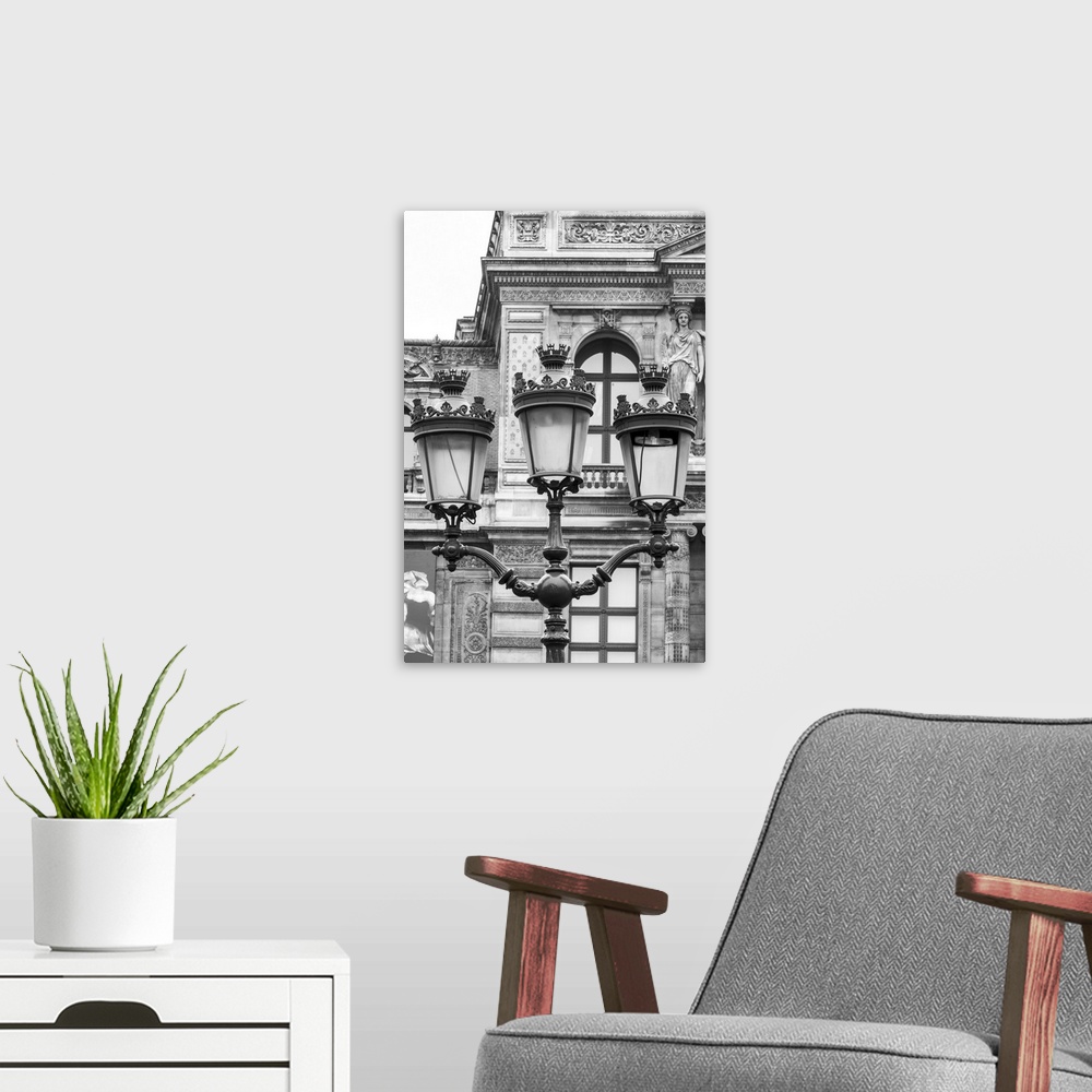 A modern room featuring Vintage street lantern detailed close-up in front of Louvre museum, Paris, France. Black and whit...