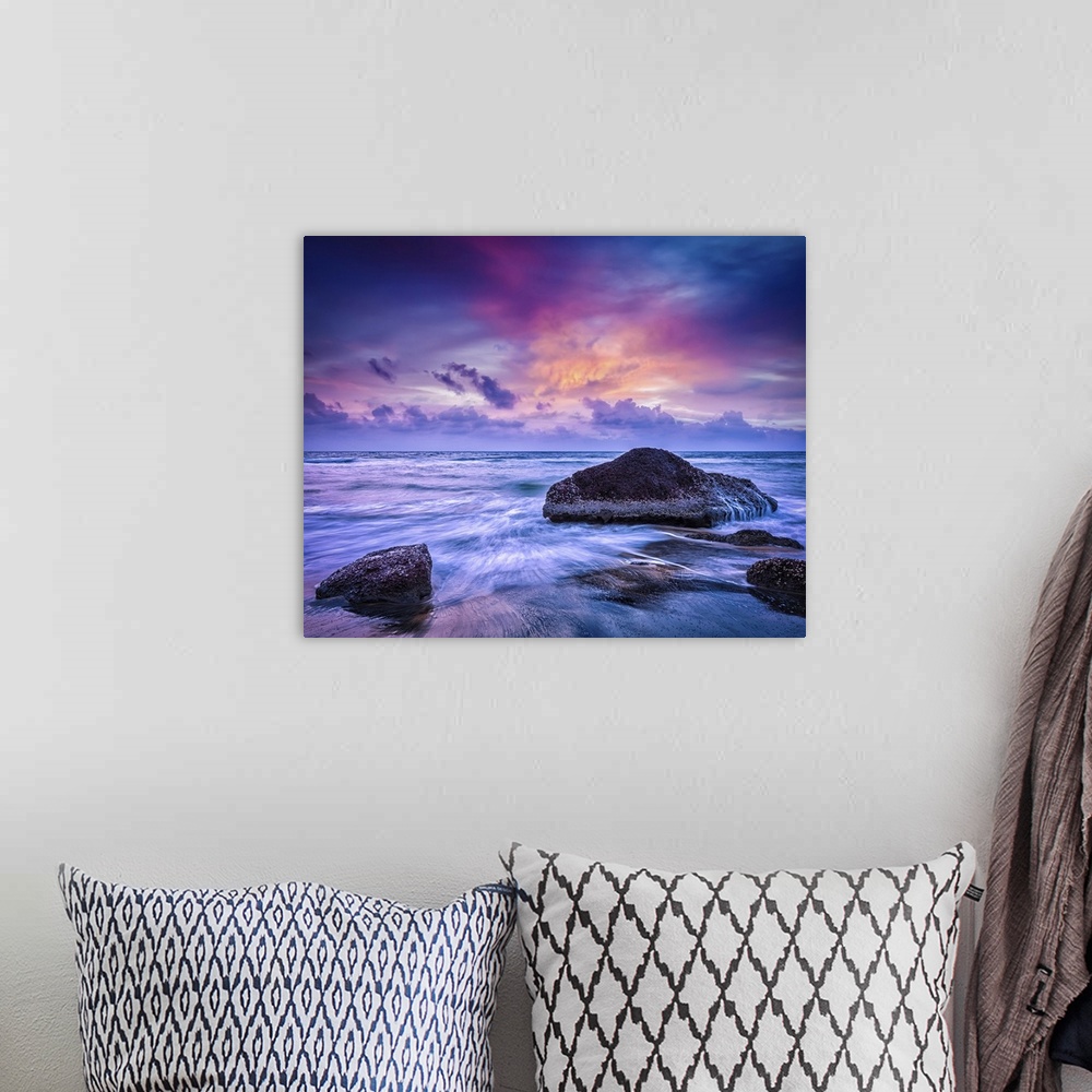 A bohemian room featuring Waves And Rocks On Beach At Sunset