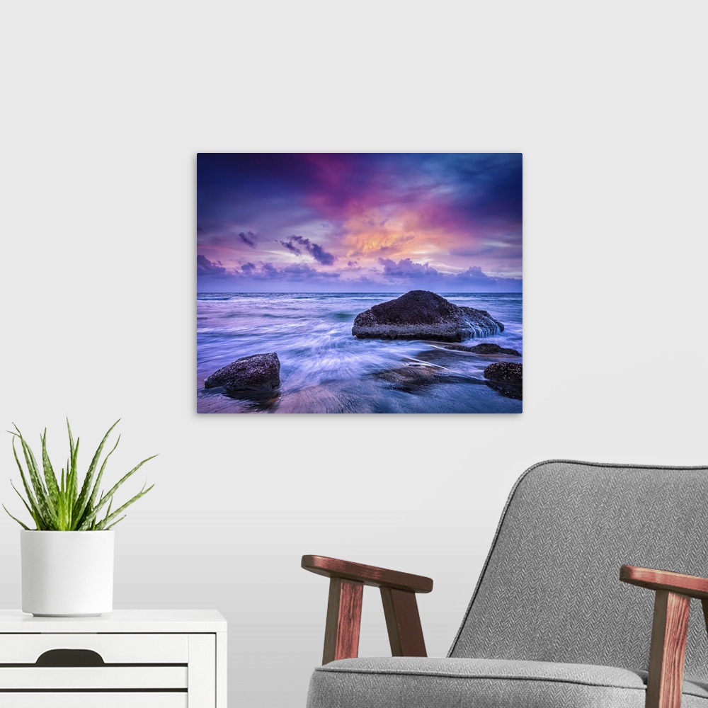 A modern room featuring Waves And Rocks On Beach At Sunset