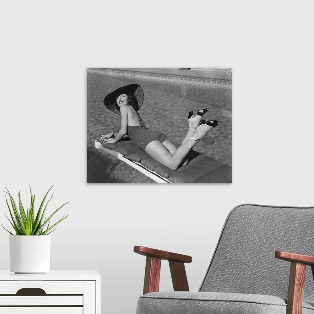 A modern room featuring Woman Sunbathing At Pool