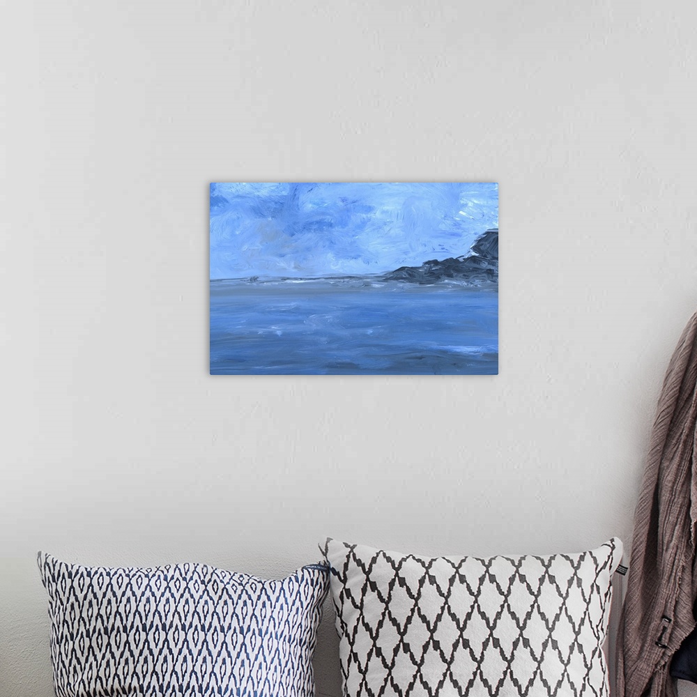 A bohemian room featuring Contemporary seascape painting of a rocky coast stretching into the ocean under a blue sky.