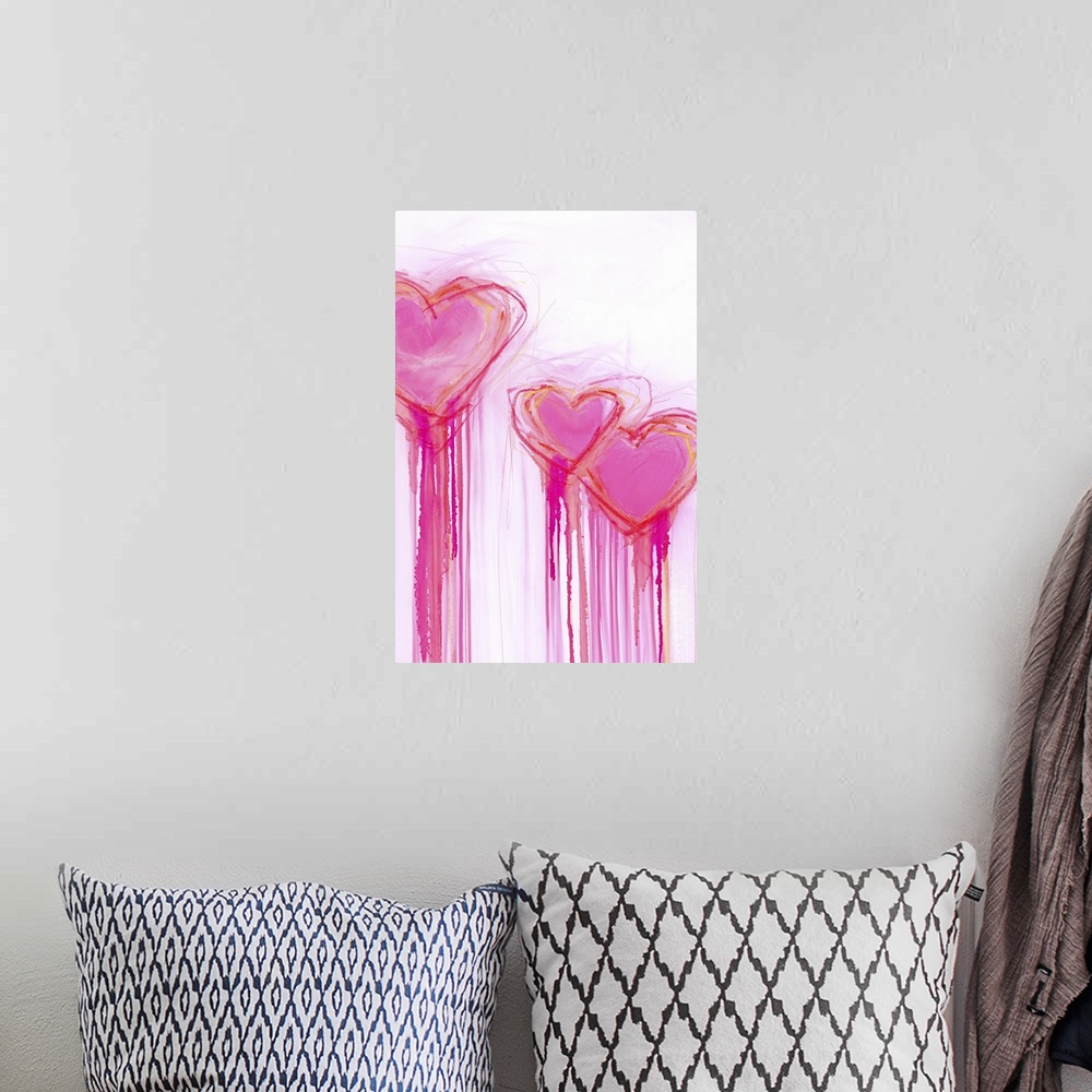A bohemian room featuring Contemporary painting of three bright pink heart shapes with long streaks of dripping paint.
