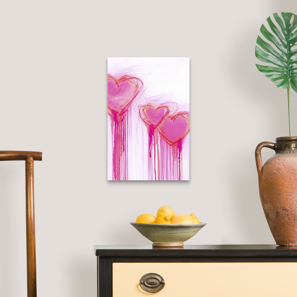 A traditional room featuring Contemporary painting of three bright pink heart shapes with long streaks of dripping paint.