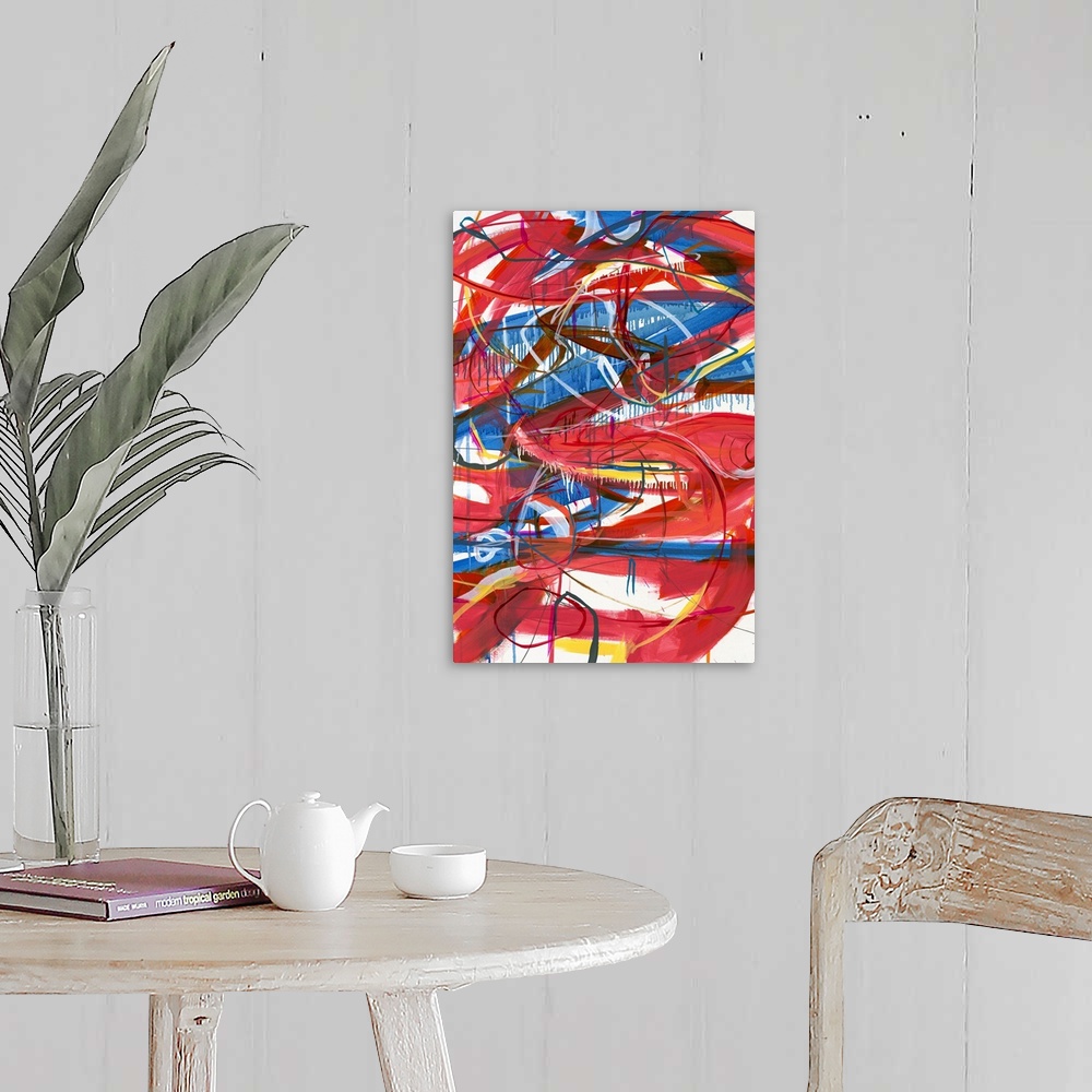 A farmhouse room featuring Large abstract painting with red, blue, magenta, yellow, orange, and white lines varying in size ...