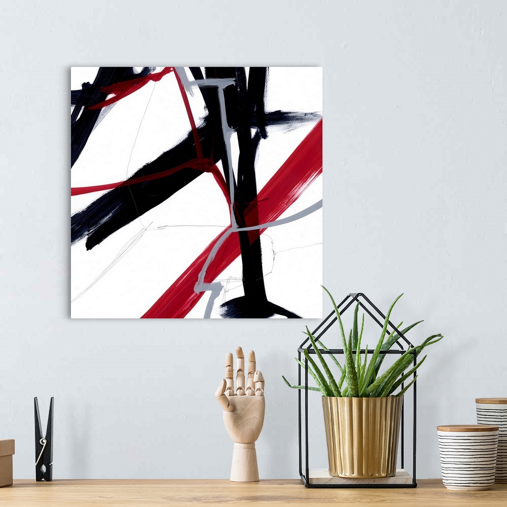 A bohemian room featuring A contemporary abstract painting of bold slashes of red and black paint strokes against a white b...