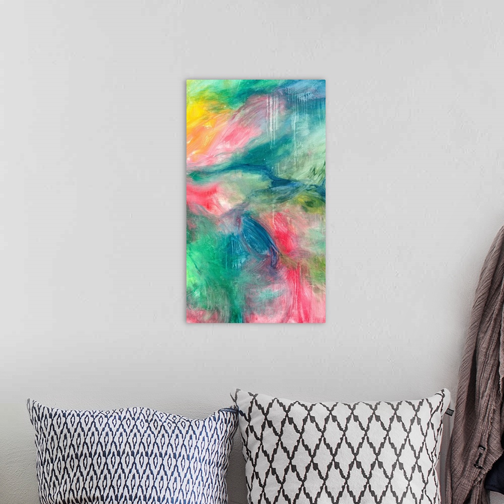 A bohemian room featuring Large abstract painting with soft but bright tones of pink, blue, green, and yellow.