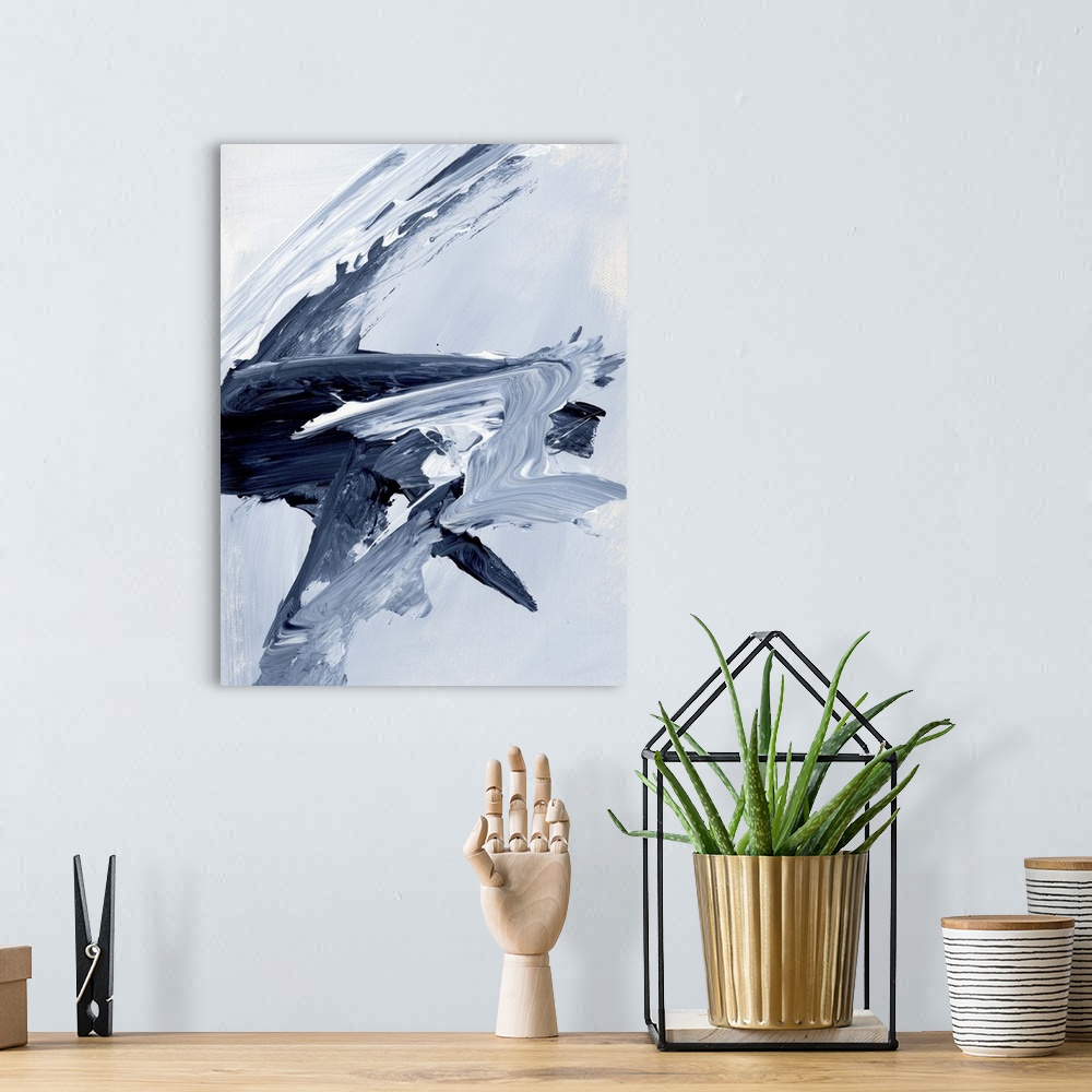 A bohemian room featuring A contemporary abstract painting using a variety of dark and light blue tones in a fluid slashing...