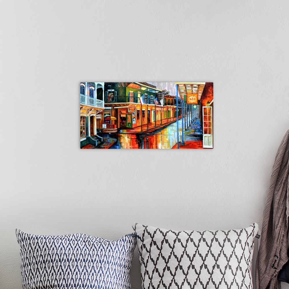 A bohemian room featuring Contemporary painting of Bourbon street in New Orleans at night illuminated in vibrant colors.