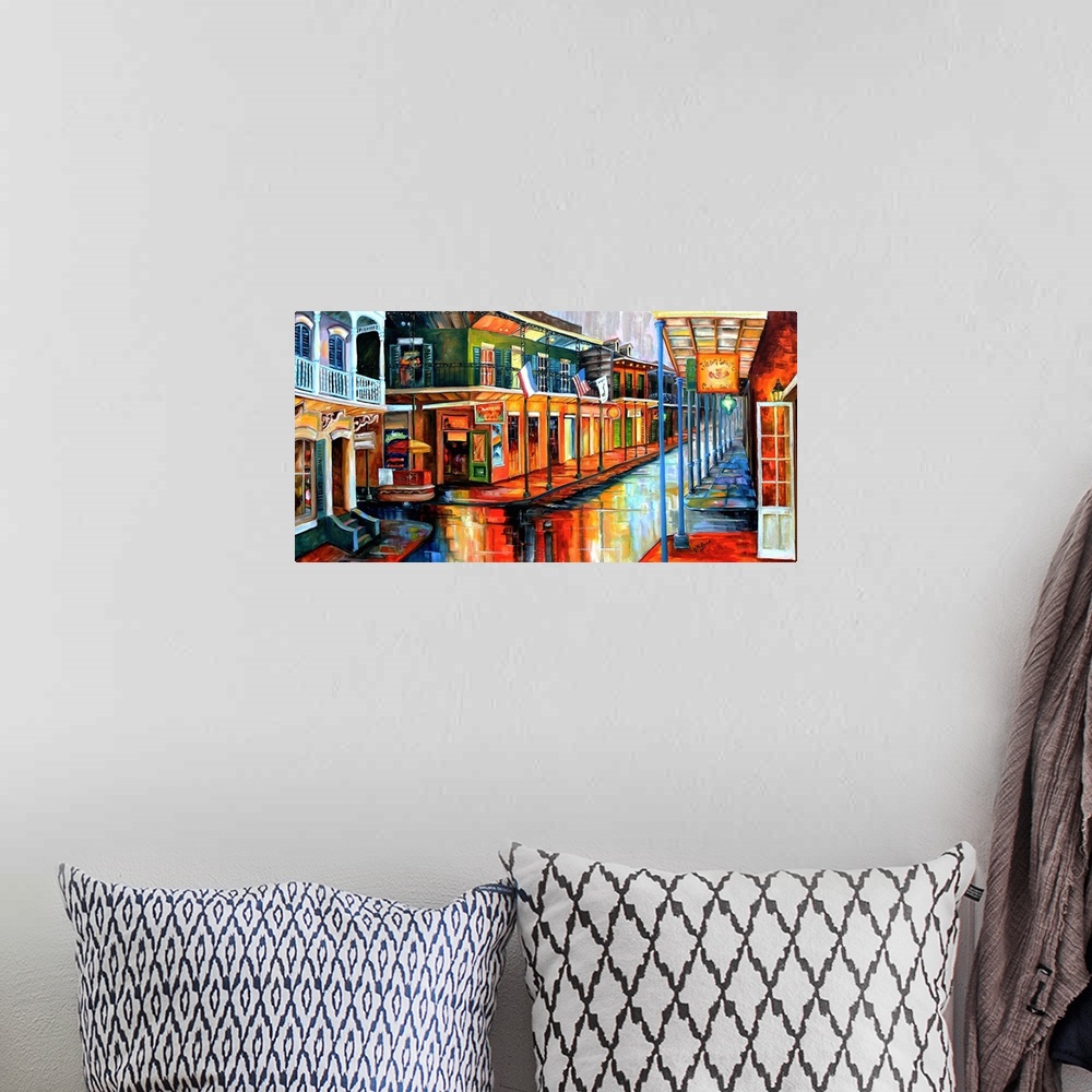 A bohemian room featuring Contemporary painting of Bourbon street in New Orleans at night illuminated in vibrant colors.