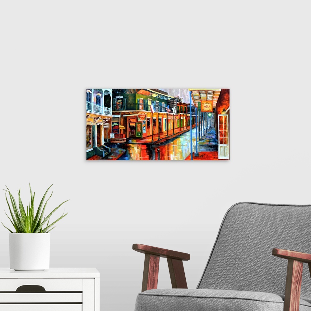 A modern room featuring Contemporary painting of Bourbon street in New Orleans at night illuminated in vibrant colors.