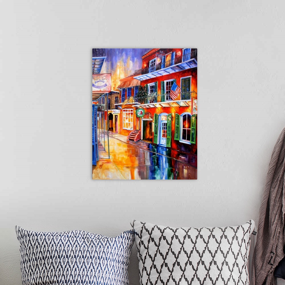 A bohemian room featuring Piece of contemporary artwork that uses a rainbow of colors to paint a street in New Orleans line...
