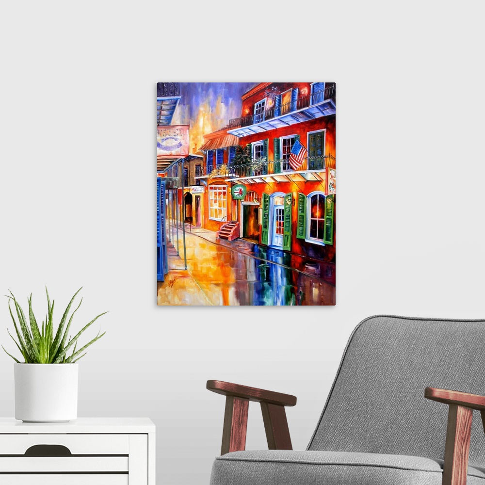 A modern room featuring Piece of contemporary artwork that uses a rainbow of colors to paint a street in New Orleans line...
