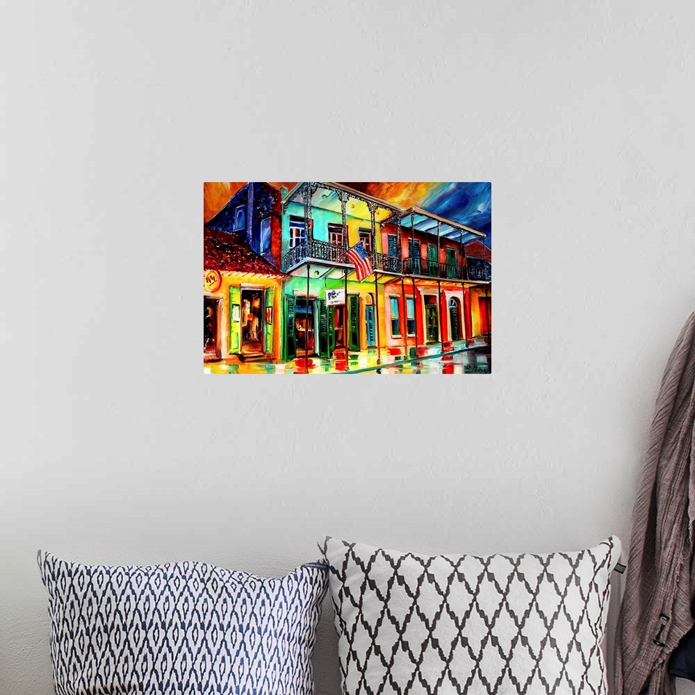 A bohemian room featuring Contemporary painting of wet city street lined with shops that have balconies.