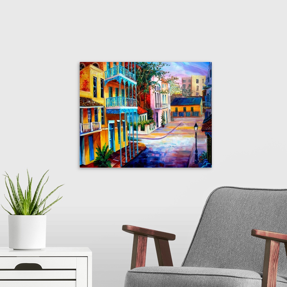 A modern room featuring Landscape painting on a large wall hanging of the sun rising over the streets of French Quarter i...