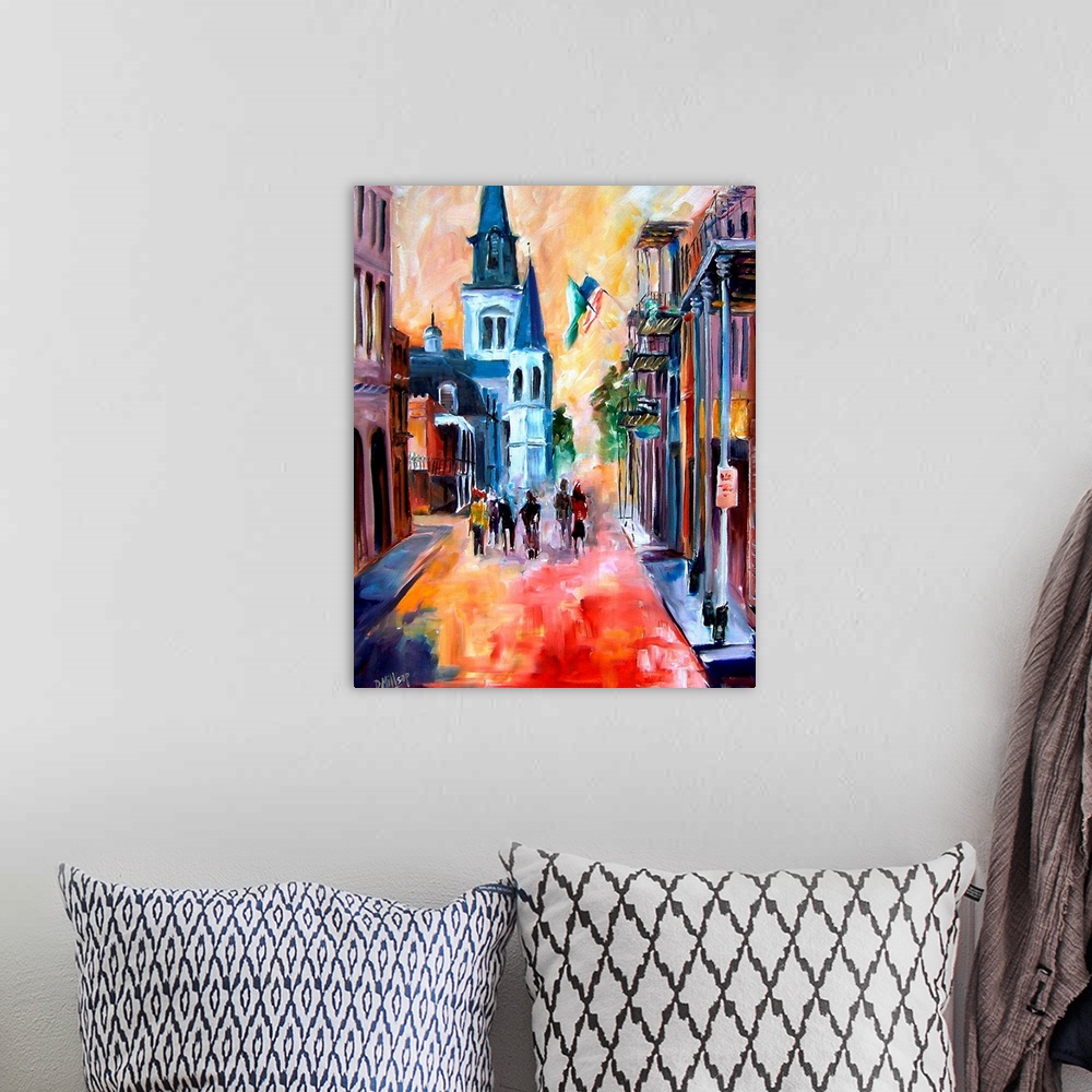 A bohemian room featuring Vertical painting on a large wall hanging of a group of people surrounded by buildings as they wa...