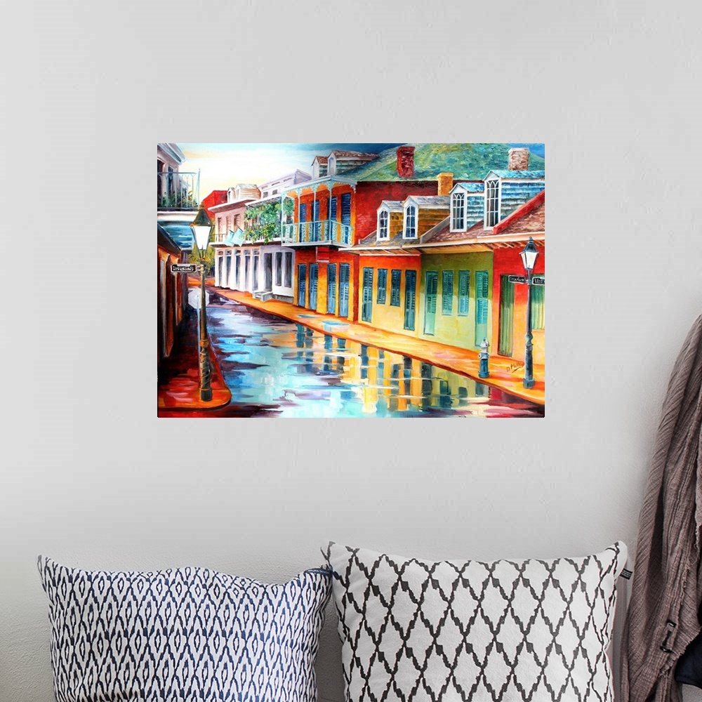 A bohemian room featuring Painting of a wet streetscape on Chartres Street in New Orleans, LA.