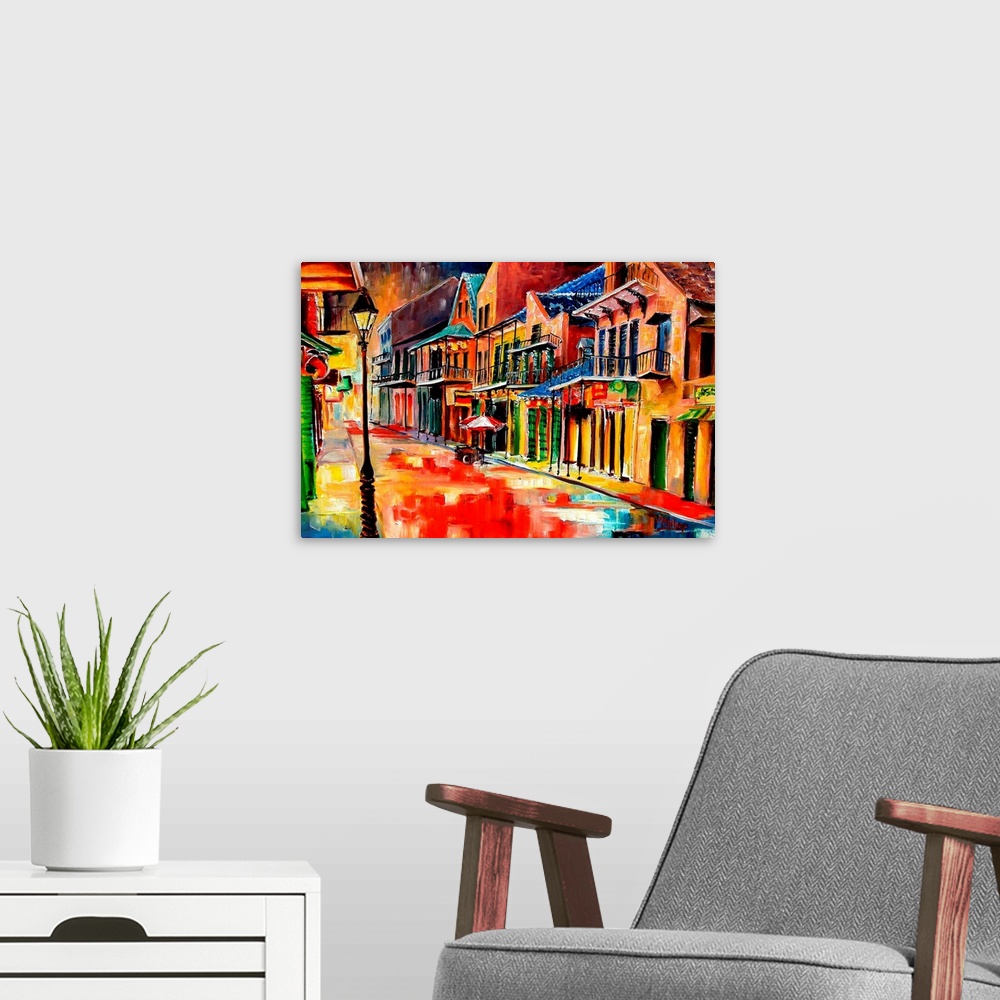 A modern room featuring Huge contemporary art shows the vibrantly colored buildings lit up on a quiet street in Louisiana...