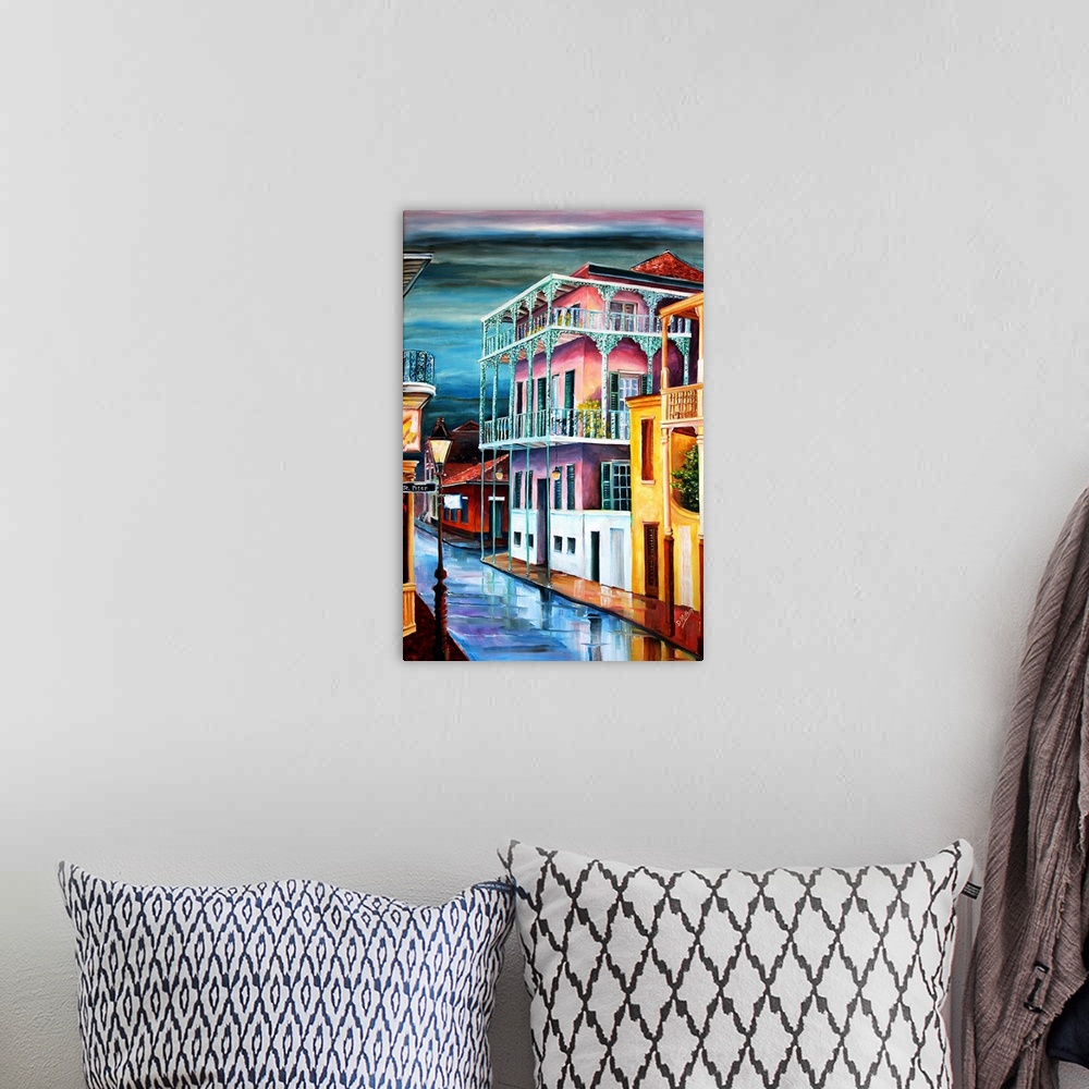A bohemian room featuring Contemporary painting of old Dauphine street in New Orleans at night illuminated in vibrant colors.