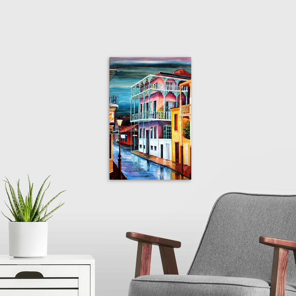 A modern room featuring Contemporary painting of old Dauphine street in New Orleans at night illuminated in vibrant colors.
