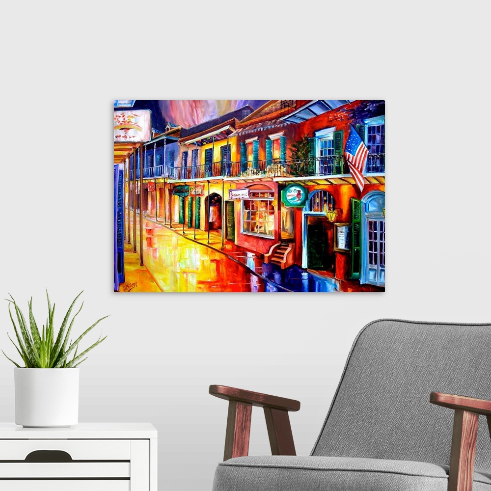 A modern room featuring Big contemporary art shows a row of vibrantly colored buildings reflecting off of the water soake...