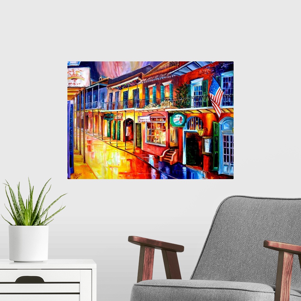 A modern room featuring Big contemporary art shows a row of vibrantly colored buildings reflecting off of the water soake...