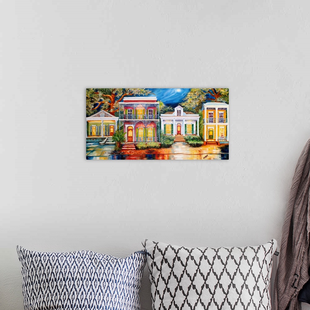 A bohemian room featuring Vibrant painting of a row of home facades in New Orleans, LA.