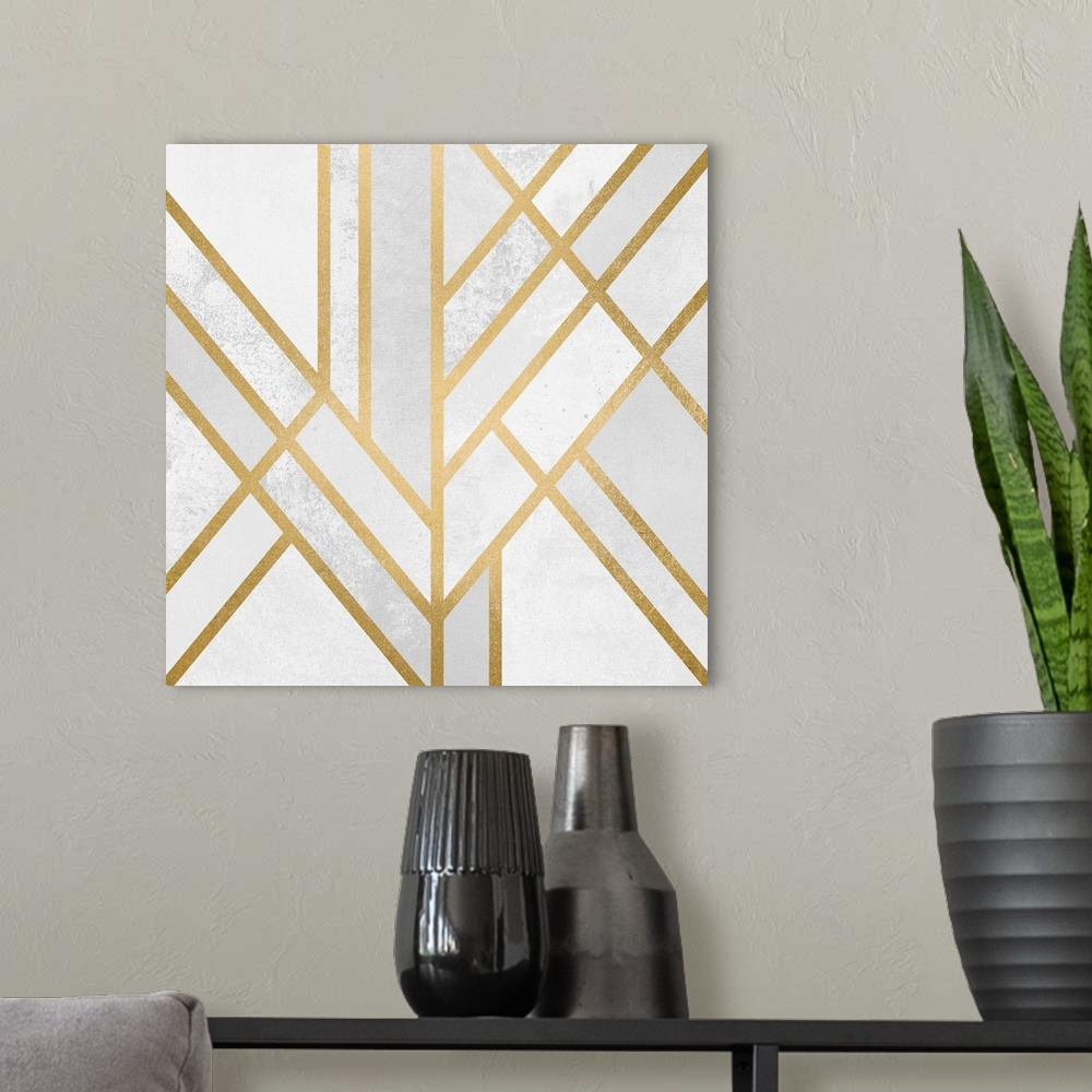 A modern room featuring A simple art deco design in gold lines on a cream and marbled pale grey background