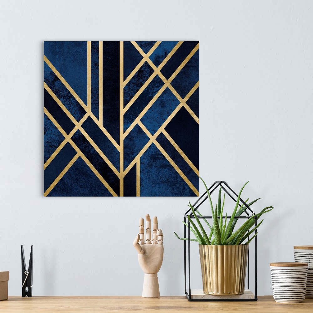 A bohemian room featuring A simple art deco design in gold lines on a background of mottled dark blue and navy