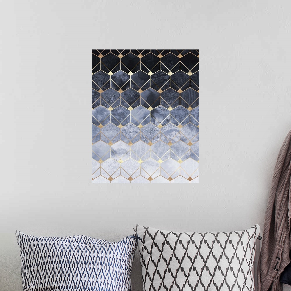 A bohemian room featuring A prism of triangles in various shades of textured ivory and navy are arranged in to form a three...