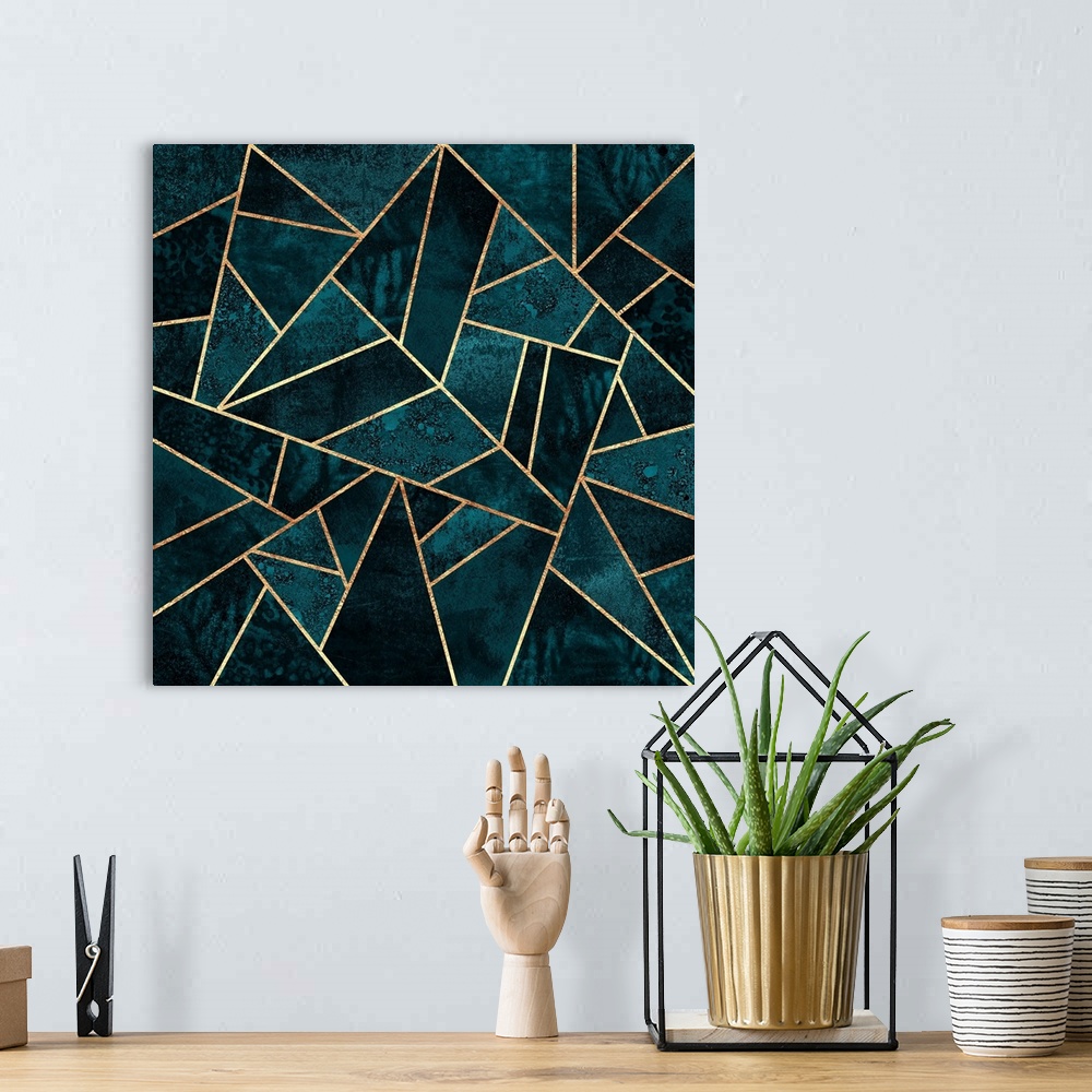 A bohemian room featuring A contemporary, geometric, art deco design in shades of dark teal. The shapes are outlined in gold.