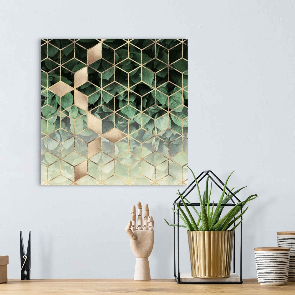 A bohemian room featuring A prism of gold triangles form a three-dimensional prism effect over the image of dark green host...