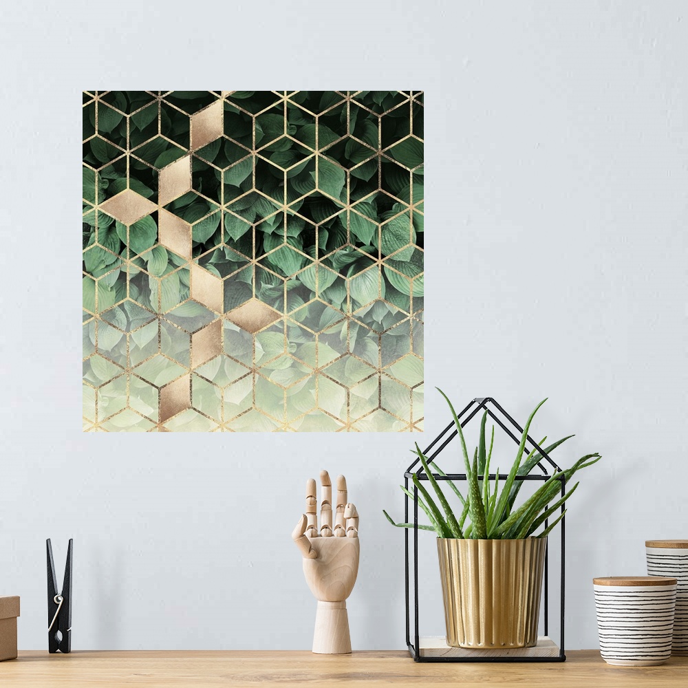 A bohemian room featuring A prism of gold triangles form a three-dimensional prism effect over the image of dark green host...