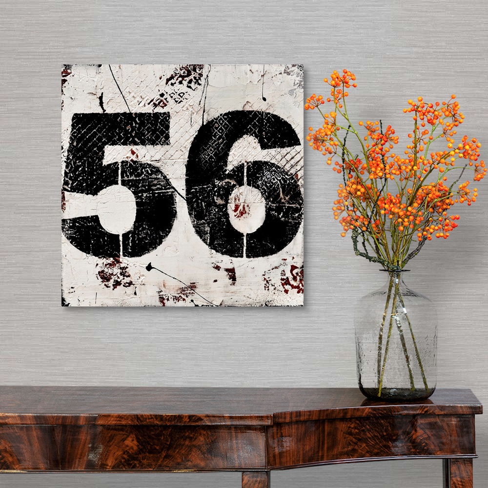 A traditional room featuring A contemporary abstract painting using a neutral toned background with a bold black number fifty-...