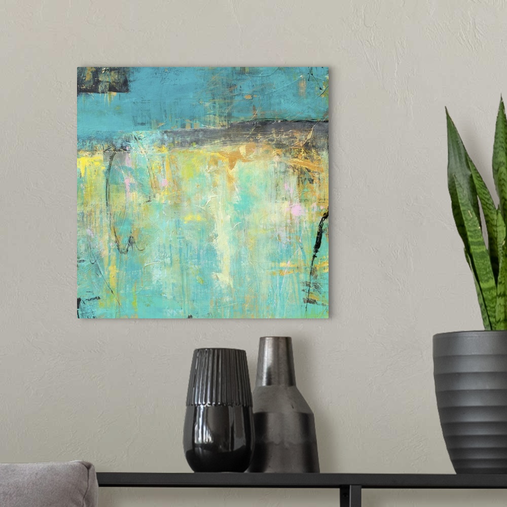 A modern room featuring A square contemporary abstract painting with a variety of blue and yellow hues in combination wit...