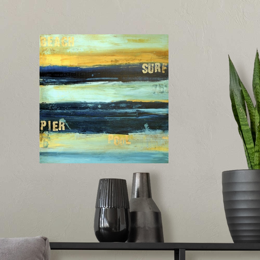 A modern room featuring Square abstract painting with stenciled beach words over top.