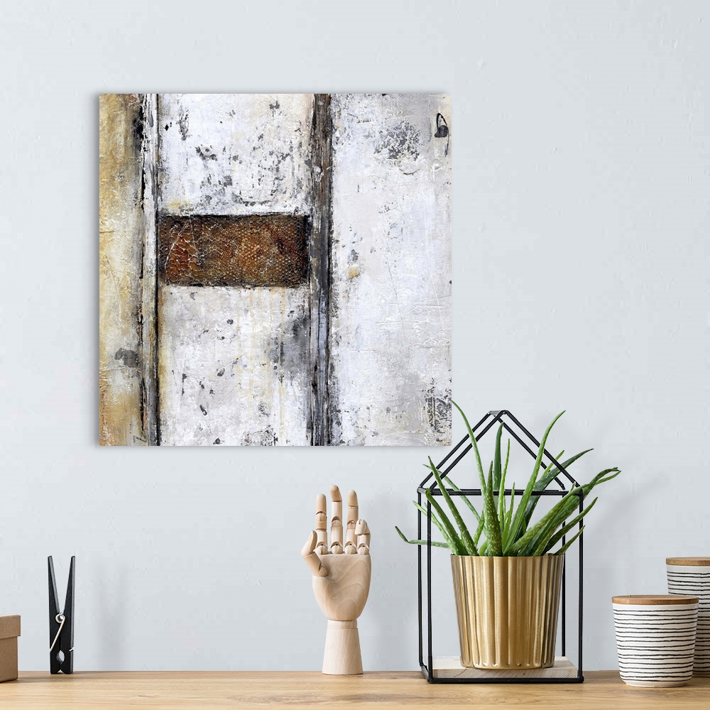 A bohemian room featuring A contemporary abstract painting using geometric shapes and neutral tones.