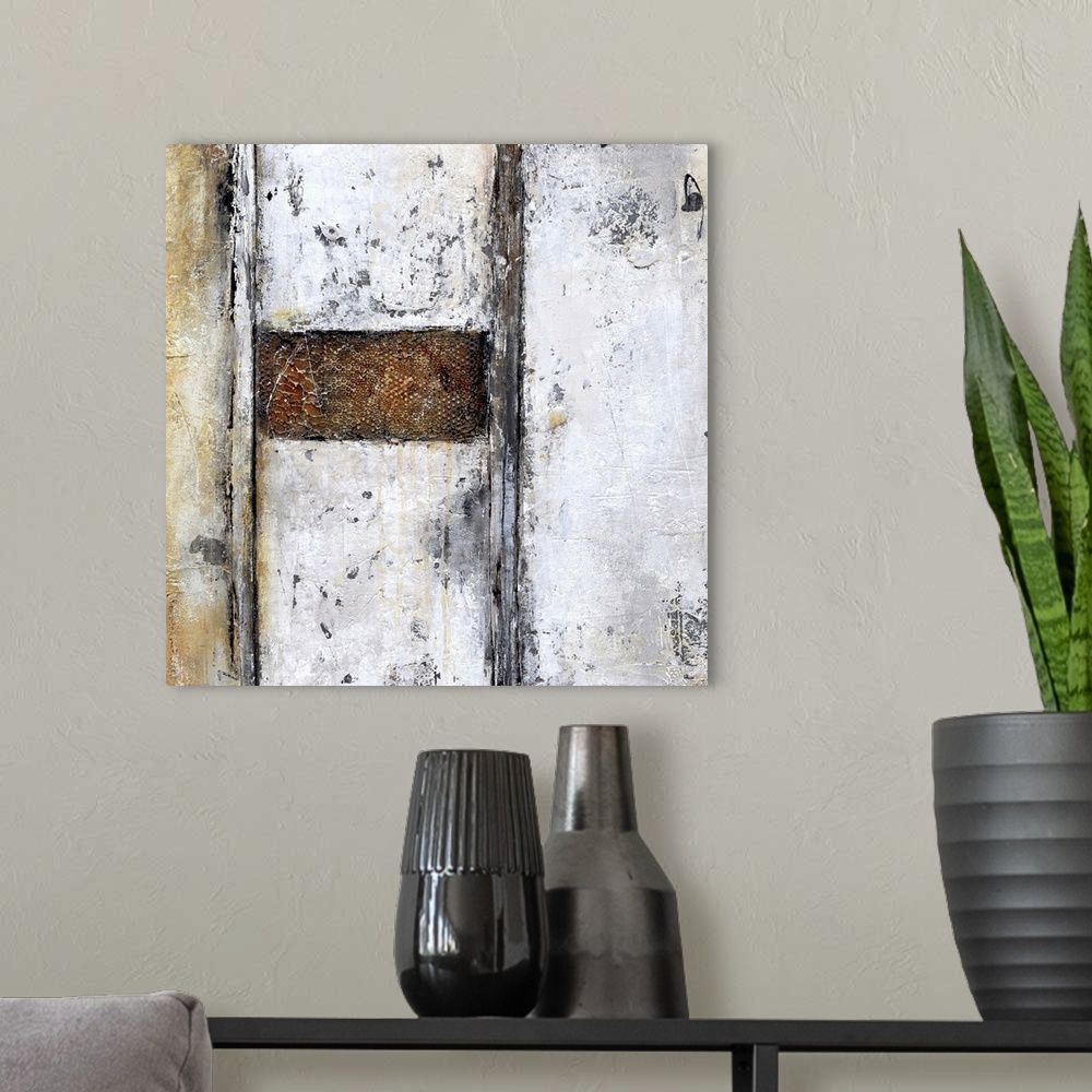 A modern room featuring A contemporary abstract painting using geometric shapes and neutral tones.