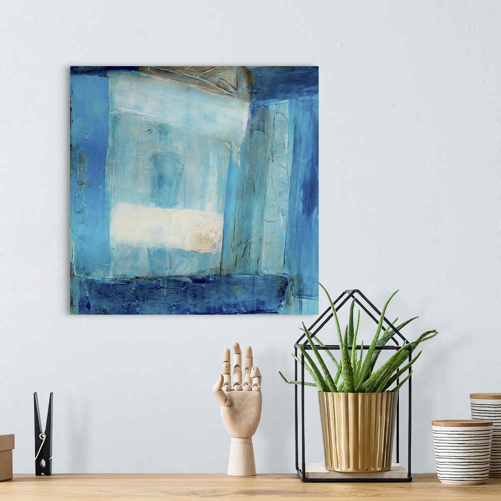 A bohemian room featuring Abstract contemporary art print in color blocks of varying shades of deep blue.