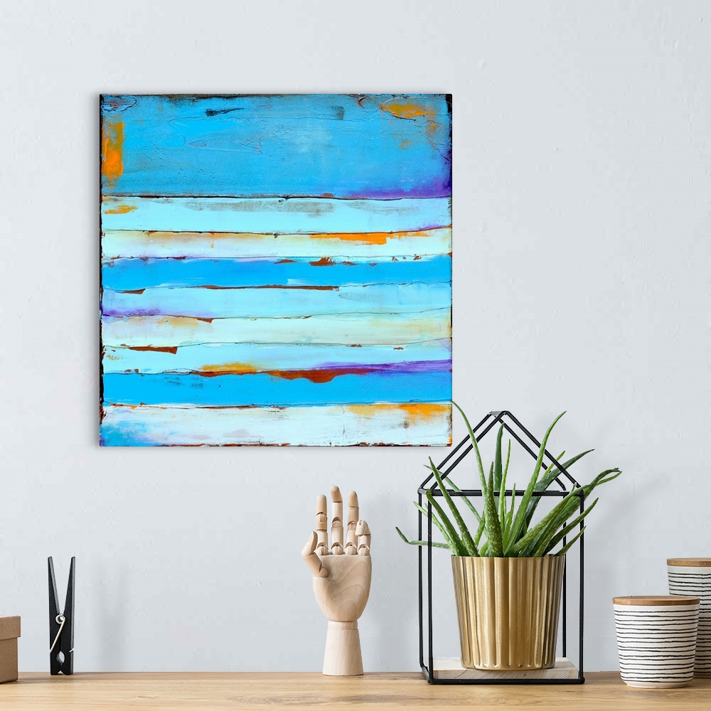 A bohemian room featuring Contemporary abstract painting painting using tones of blue.