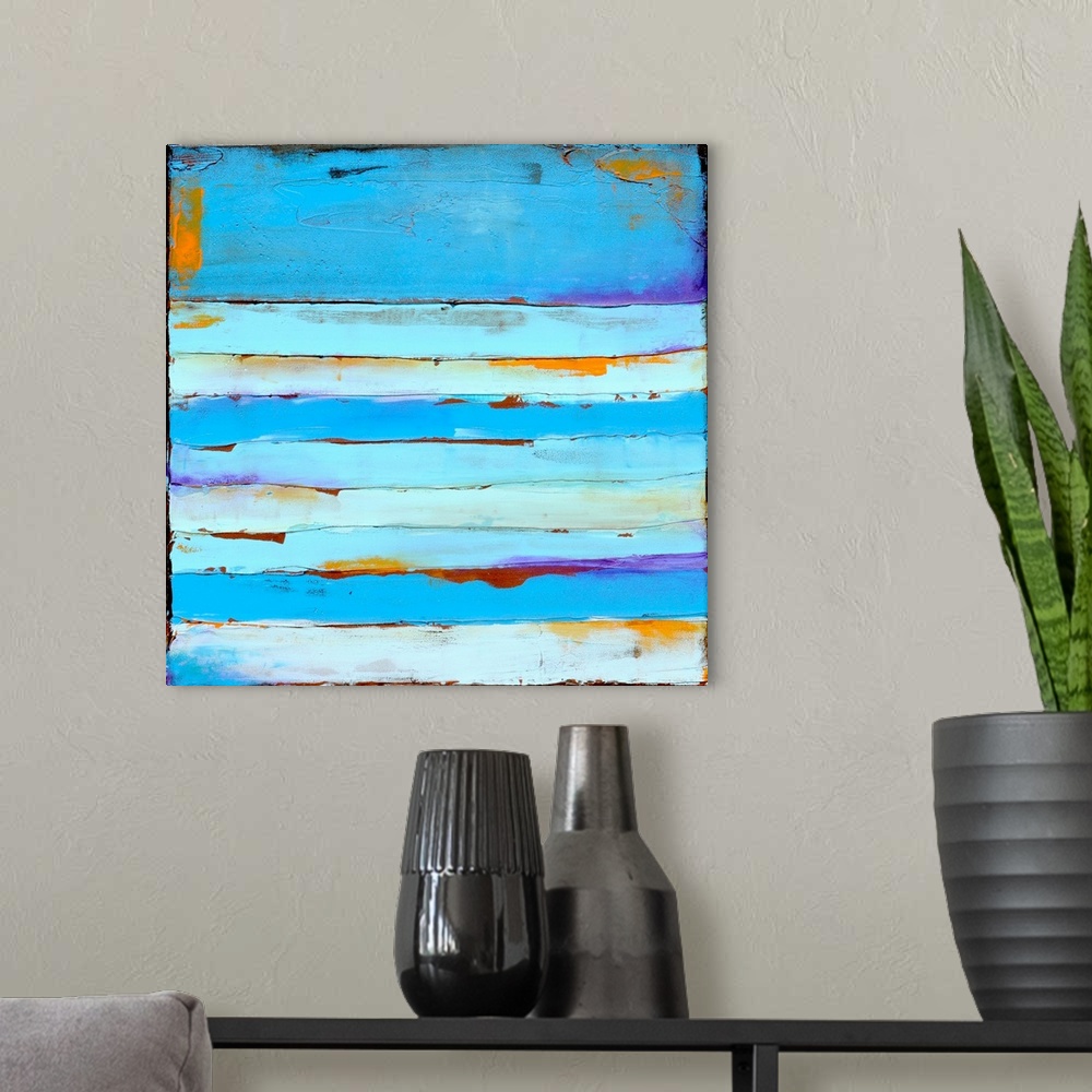 A modern room featuring Contemporary abstract painting painting using tones of blue.