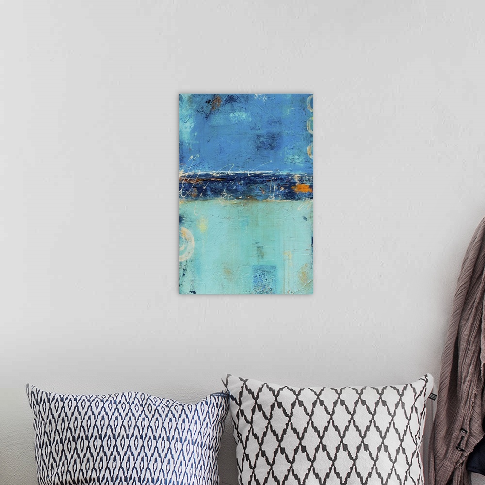 A bohemian room featuring Contemporary abstract painting in shades of blue and teal, with small ring shapes.