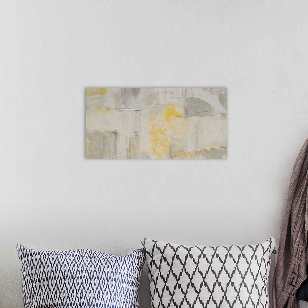 A bohemian room featuring Contemporary abstract artwork in pale, muted shades of grey and yellow.